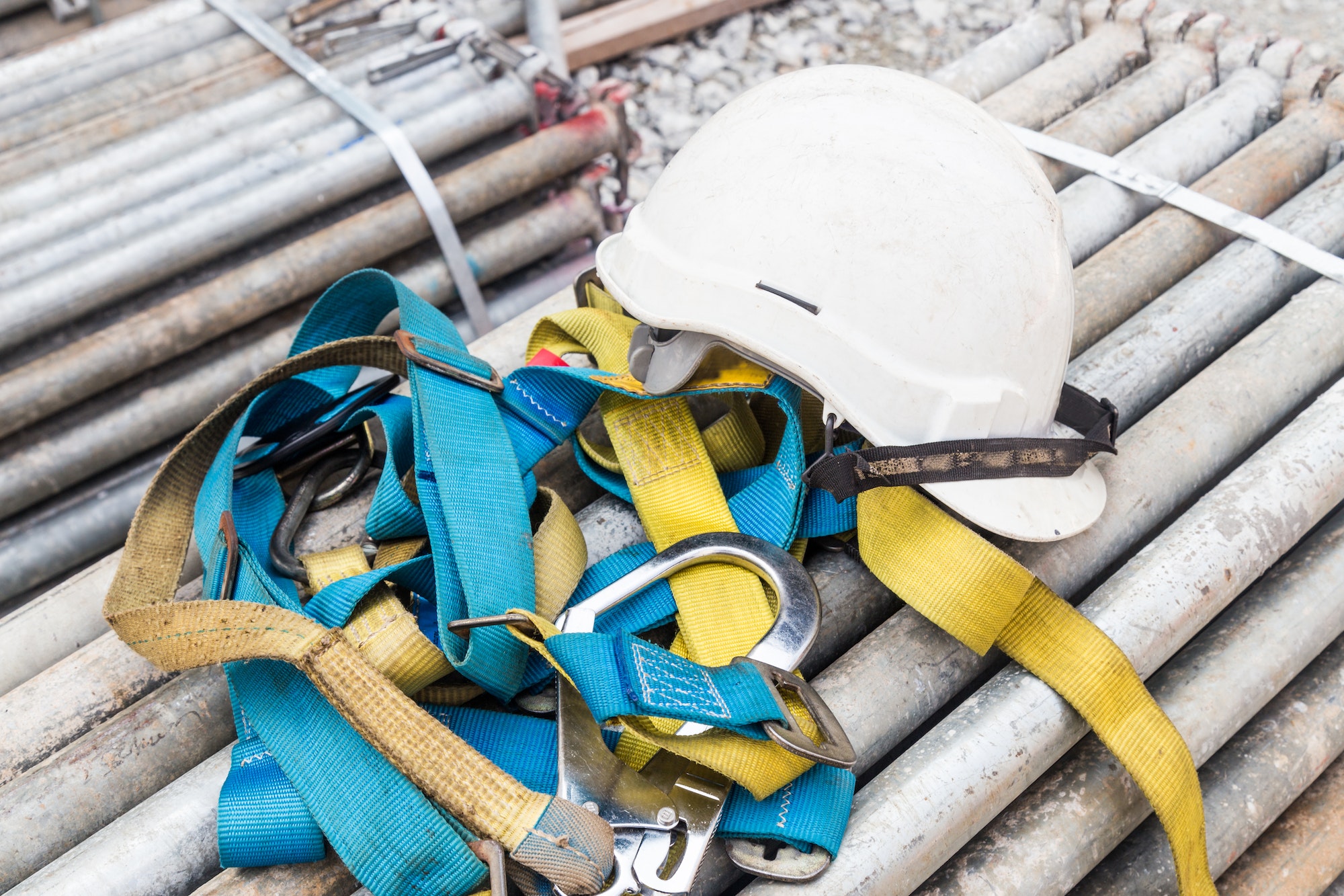 Safety helmet and safety harness at a construction site