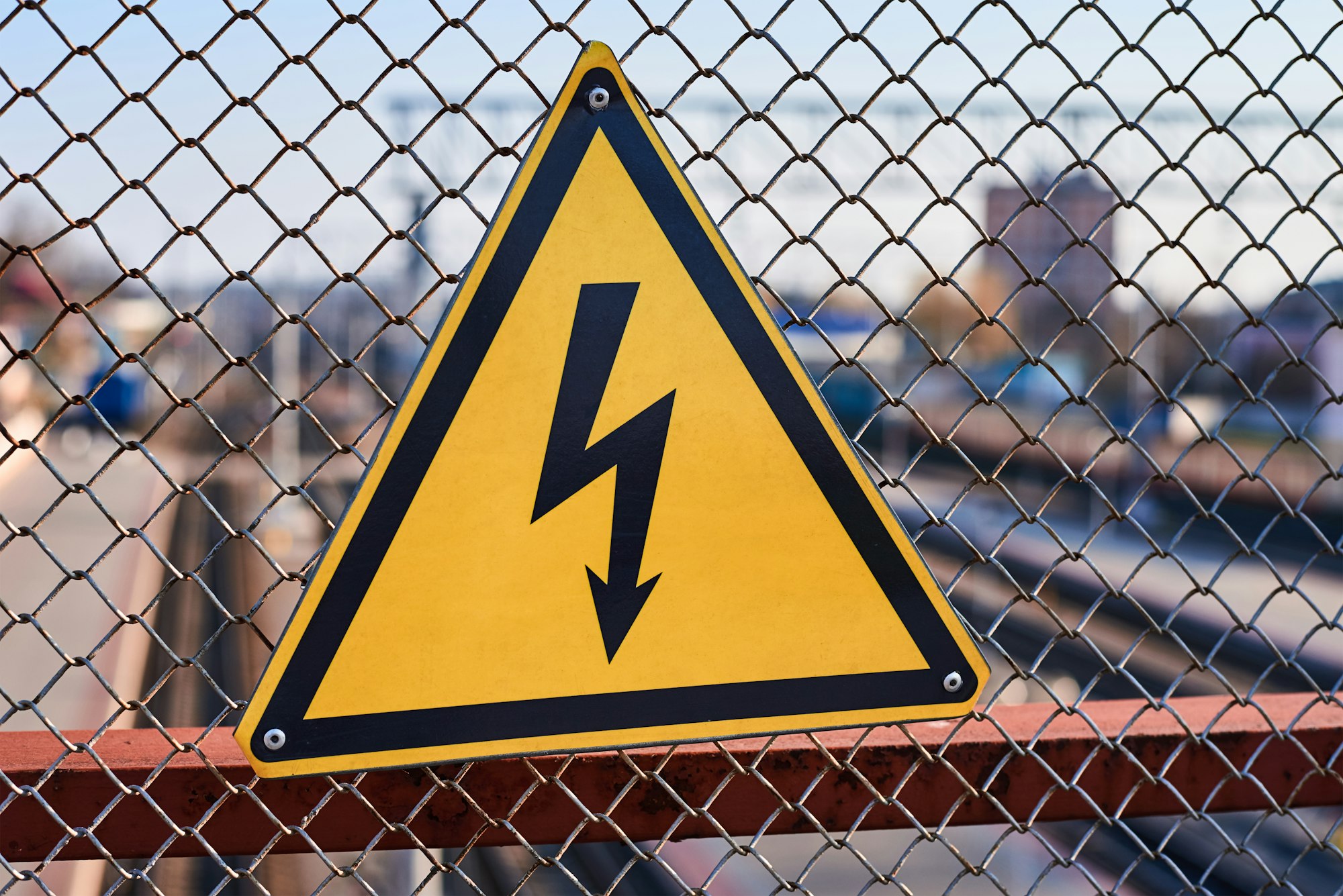 Electrical hazard sign. High voltage electricity on a railway station