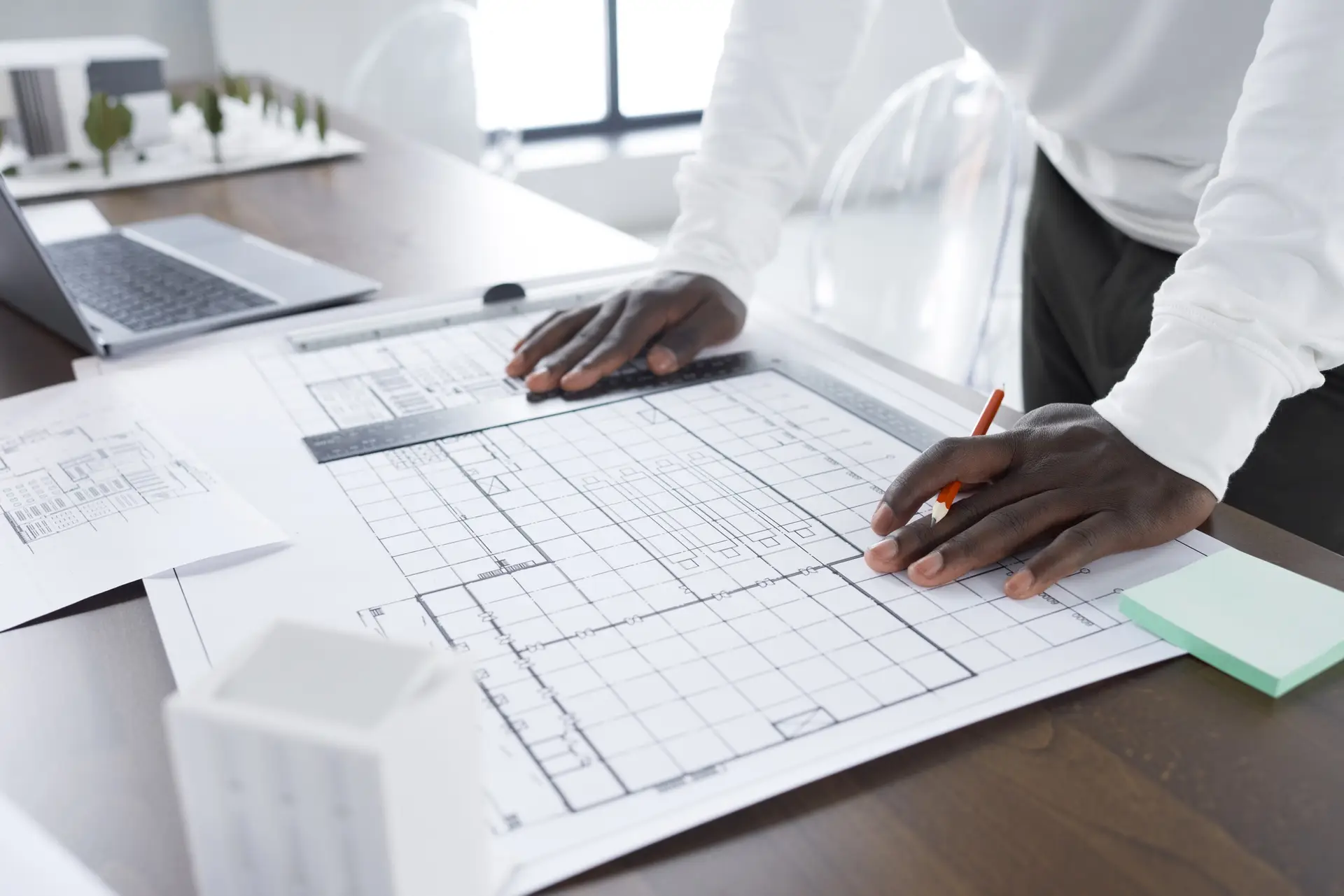 Architect drawing blueprint of the building